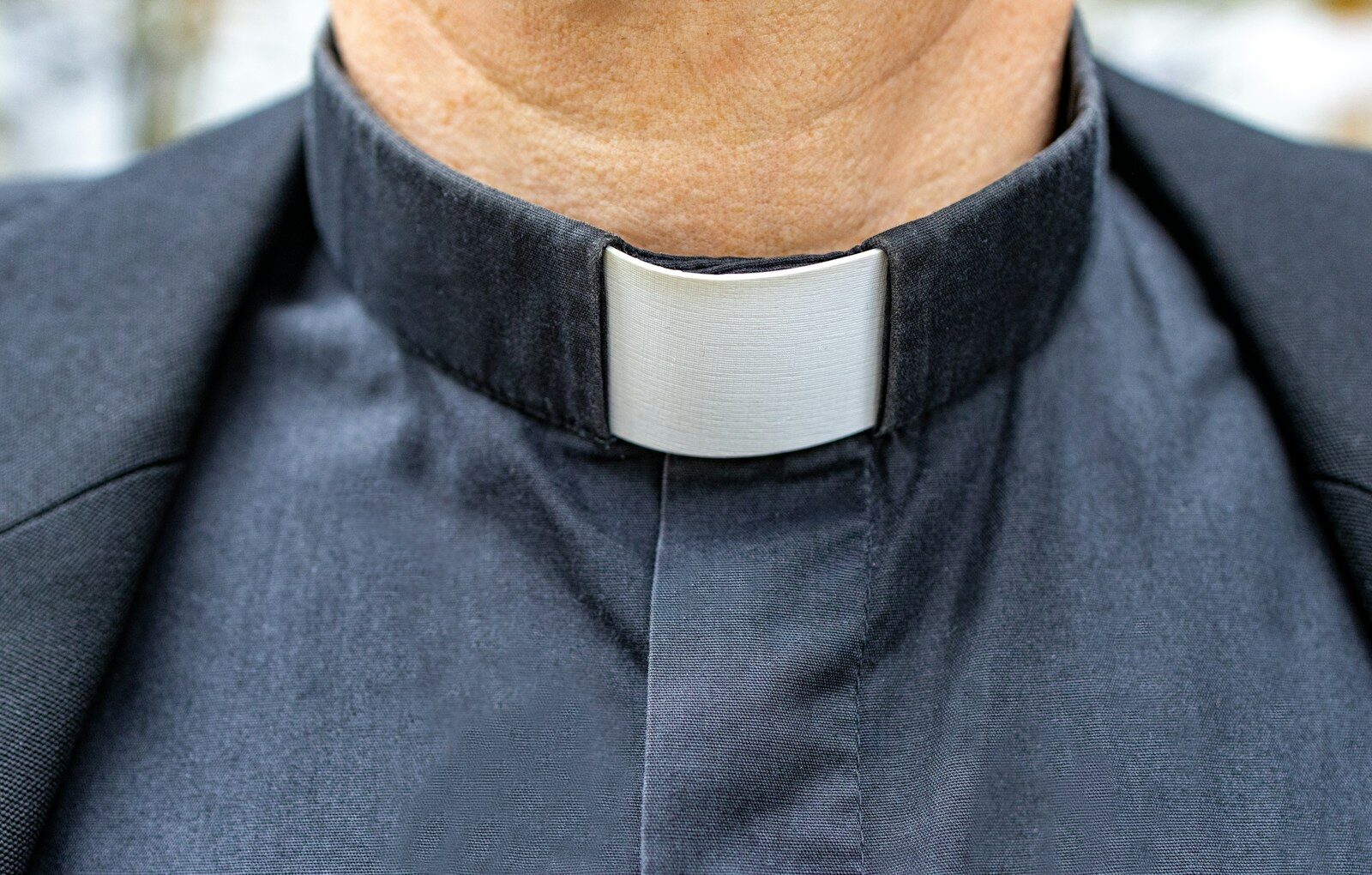 a close up of a man wearing a neck tie