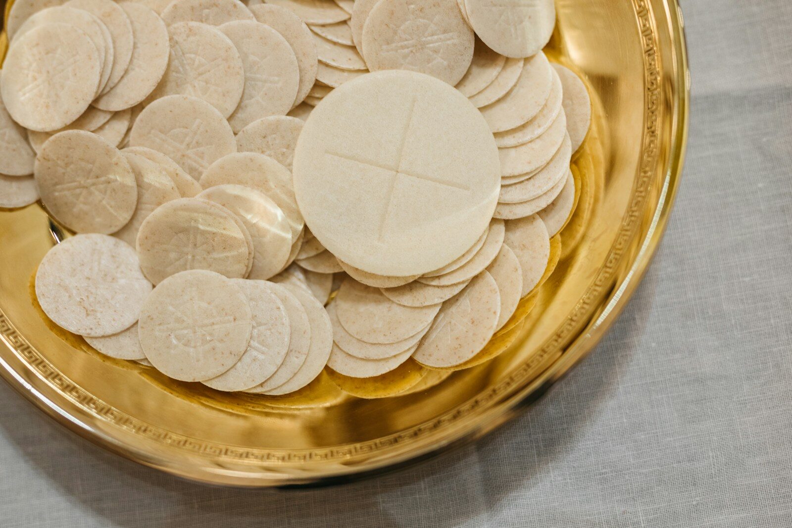 a gold plate with a bunch of cookies on it